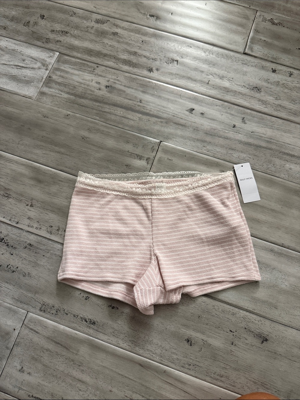Pink and white lace mini shorts